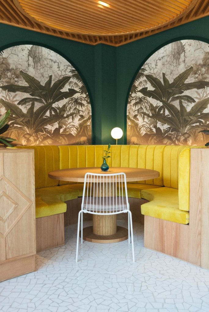 yellow themed dining area interior designers